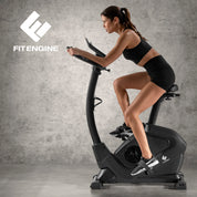 FitEngine Heimtrainer & Ergometer mit professionellem Aluminium-Schwungrad | 24 Widerstandsstufen, 28 Trainingsprogramme, verstellbarer Sportsattel, App-kompatibel | Bis 120kg, 195cm Größe